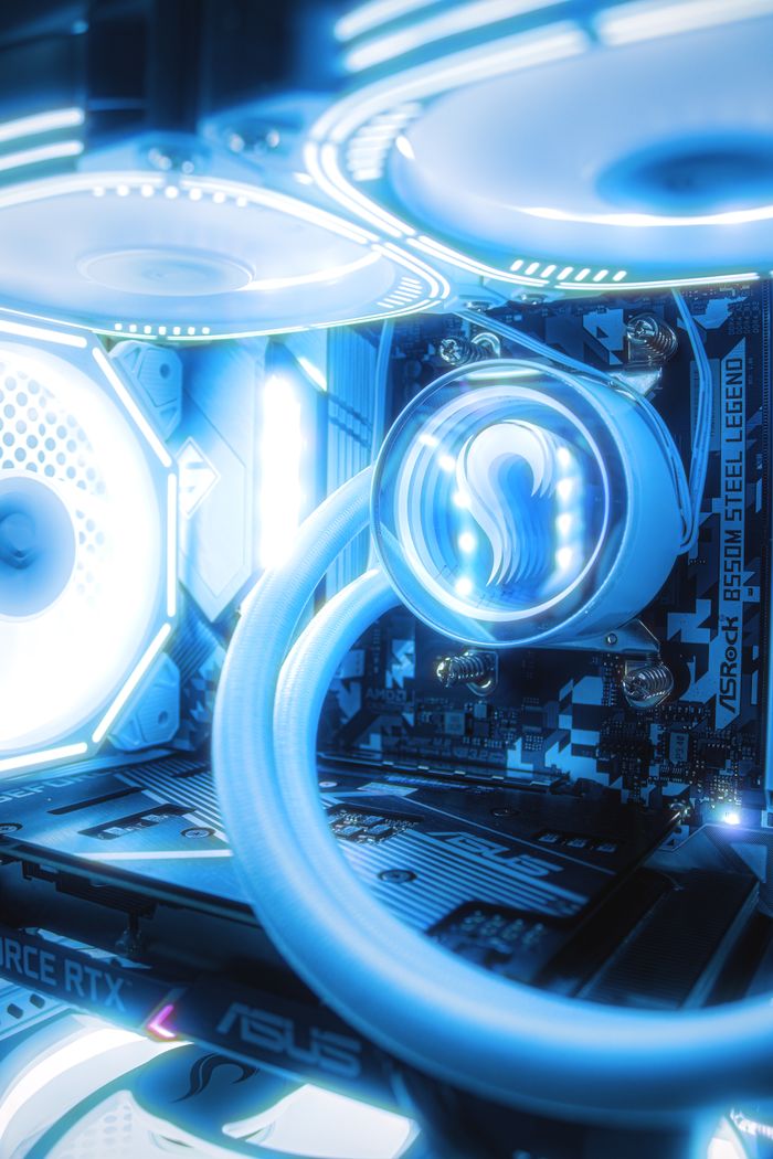 services-04 Close-up of a gaming PC with illuminated RGB lights and advanced cooling system.